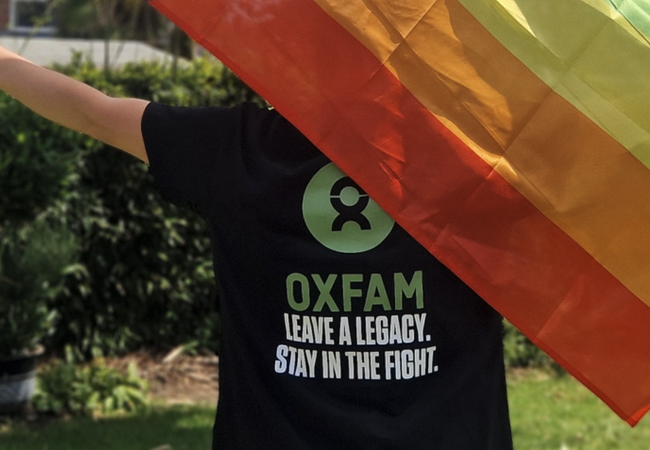 Mx Jones waving pride flag