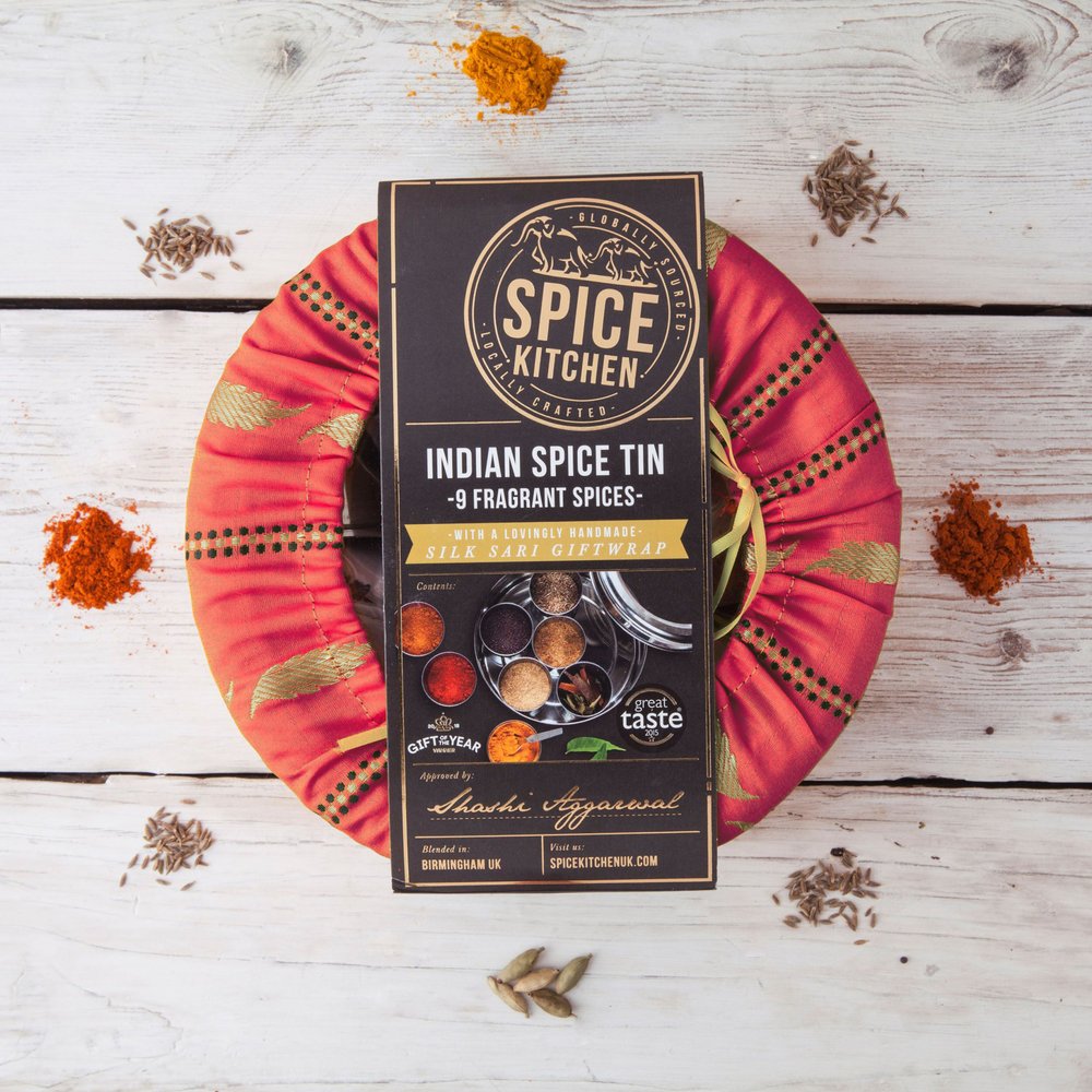 tin of delicious spices wrapped in a sari