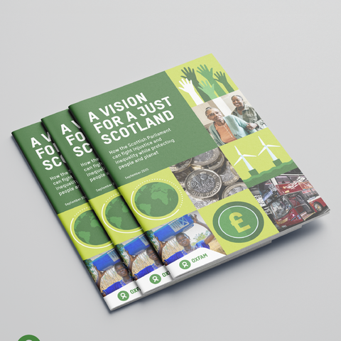 Stack of three Oxfam Scotland reports titled “A Vision for a Just Scotland: How the Scottish Parliament can fight injustice and inequality while protecting people and planet.” The cover design features green and yellow blocks with images including raised