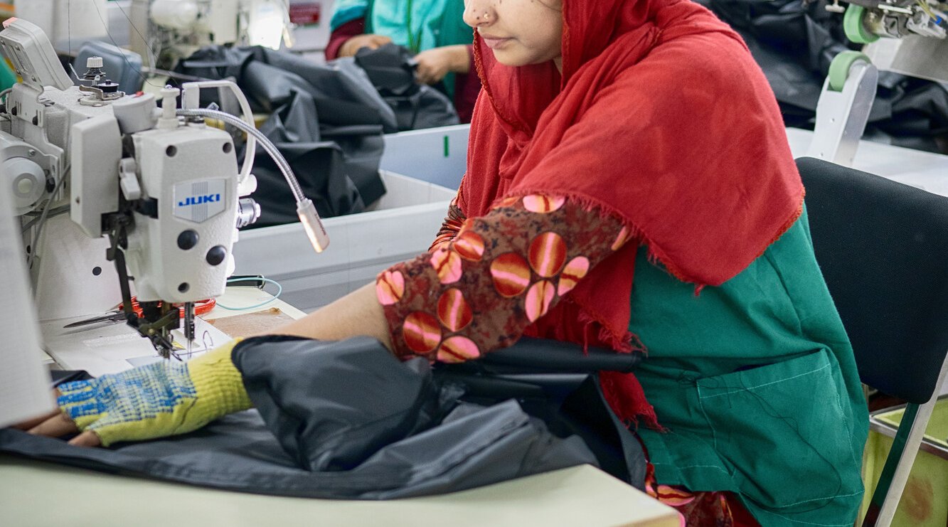 Textile workers are working inside a garment factory in Savar, Bangladesh.