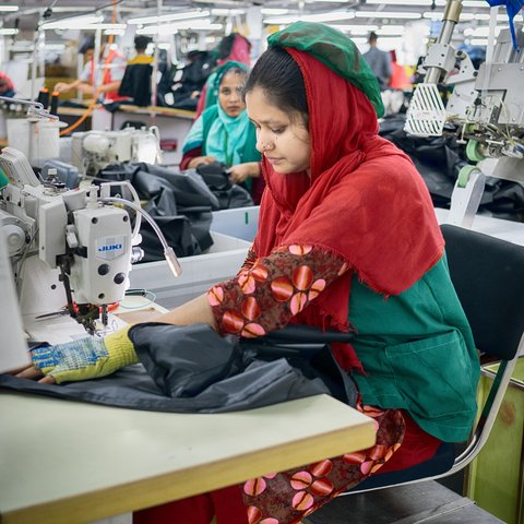 Textile workers are working inside a garment factory in Savar, Bangladesh.