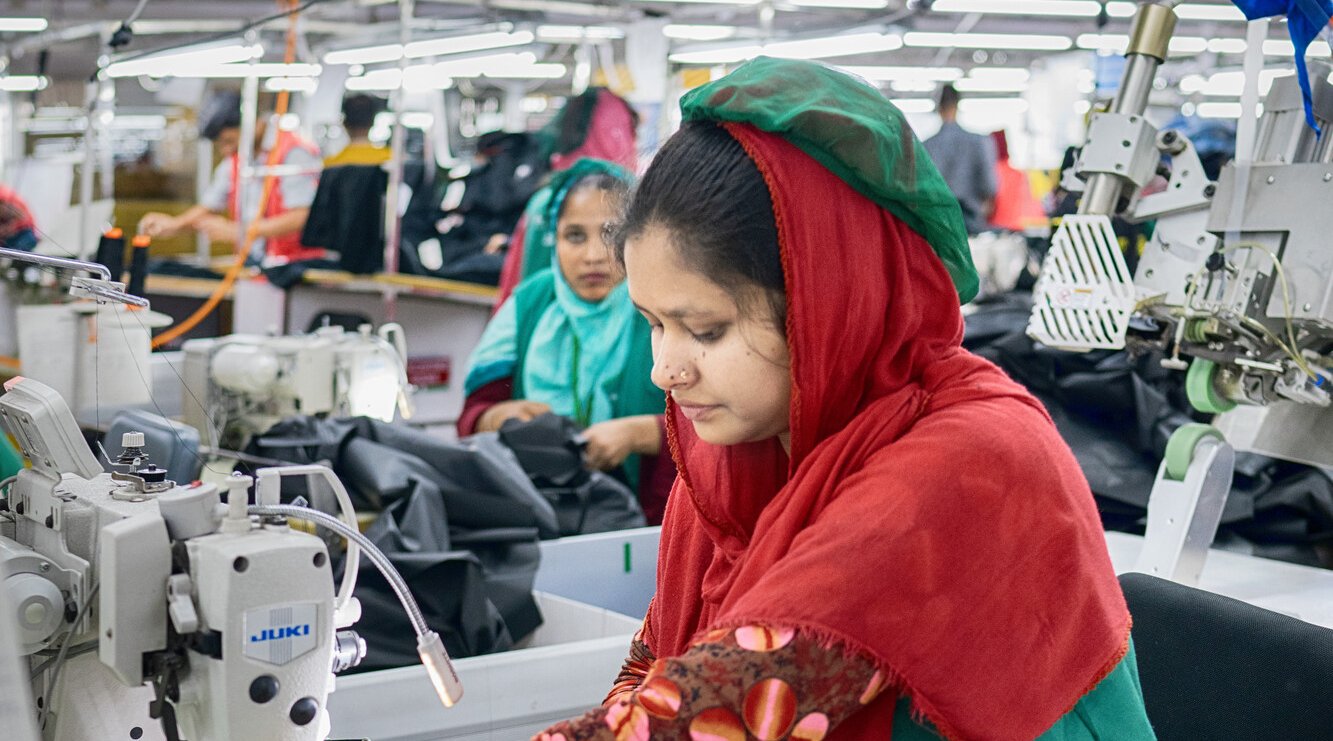 Textile workers are working inside a garment factory in Savar, Bangladesh.