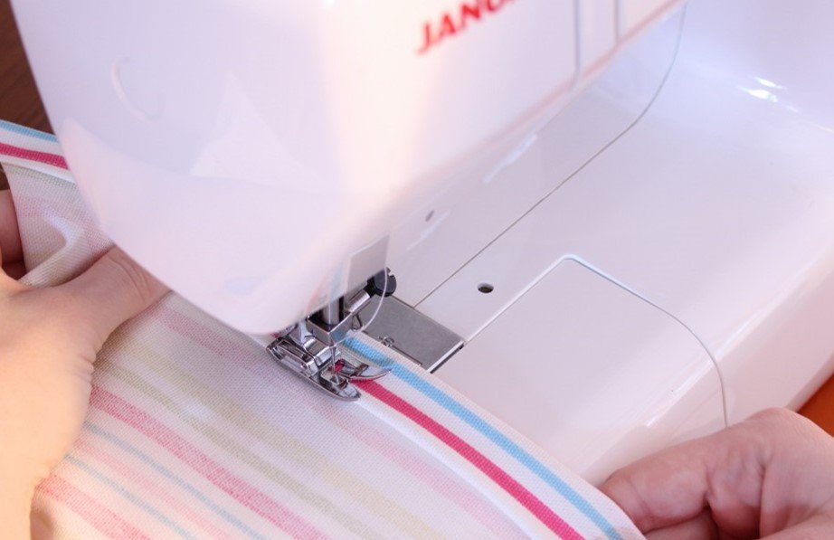 A sewing machine in the process of turning up a hem.  Photo: Cassie Fairy