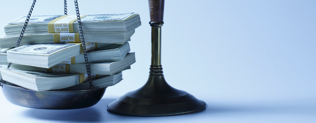 Set of scales with heavy bank notes on the left and small stack of light coins on the right.