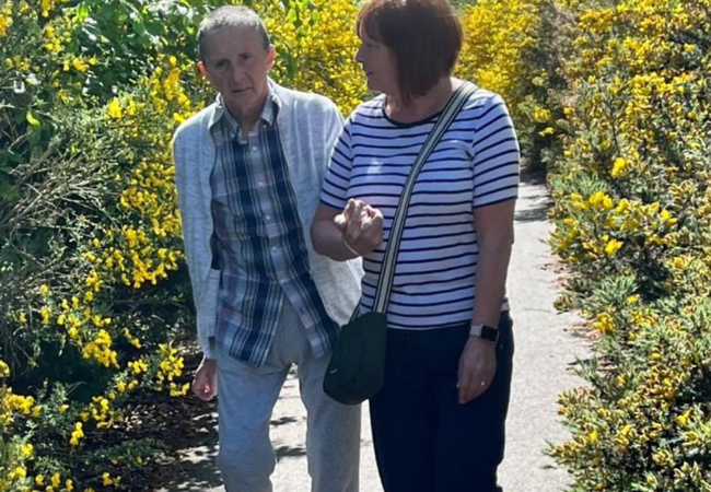 Diane McKechnie and her husband Ali taking a walk.