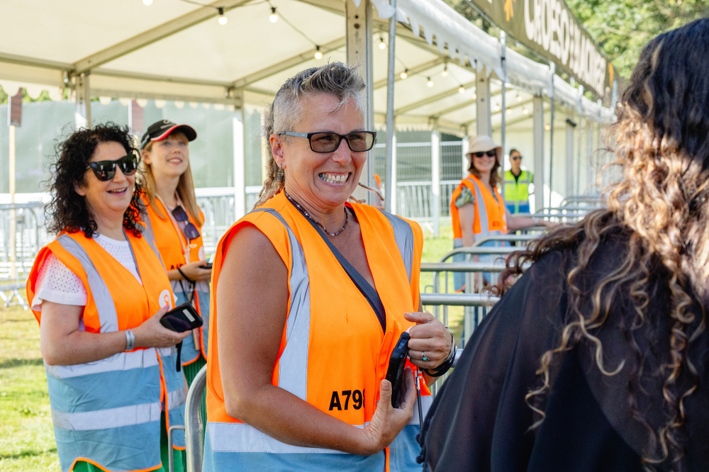Oxfam festival volunteers working on a gate at Blackweir