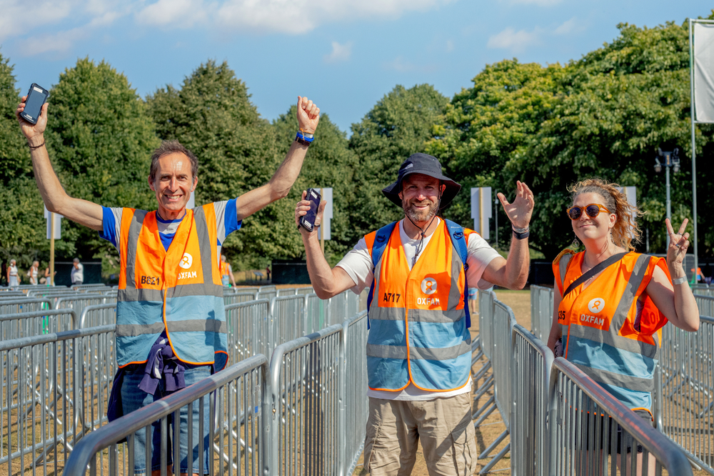 Three Oxfam festival volunteers working on the Blackweir live gates