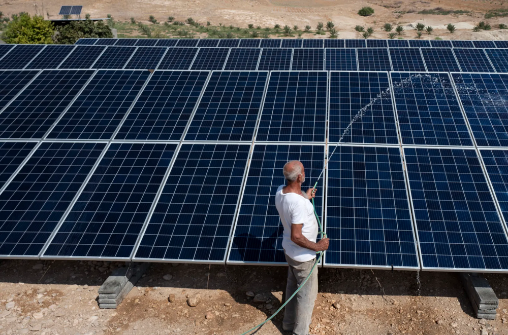 Ahmad is a date farmer in the Jordan Valley. He manages a date plantation and takes care of a new solar water system installed by Oxfam and a local partner. Photo: Kieran Doherty/Oxfam