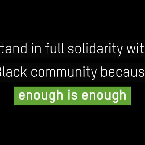 The words 'we stand in full solidarity with the Black community because enough is enough' on a black background.