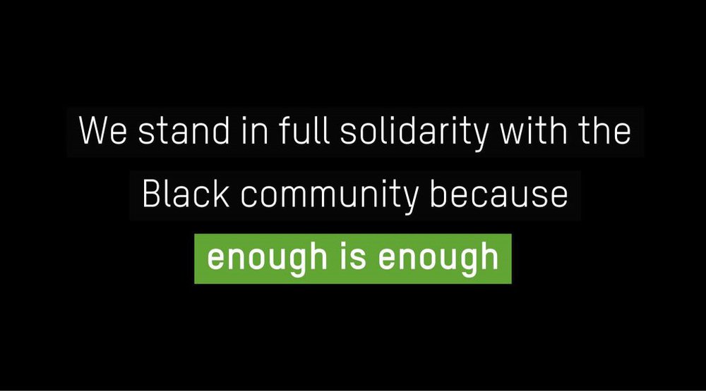 The words 'we stand in full solidarity with the Black community because enough is enough' on a black background.