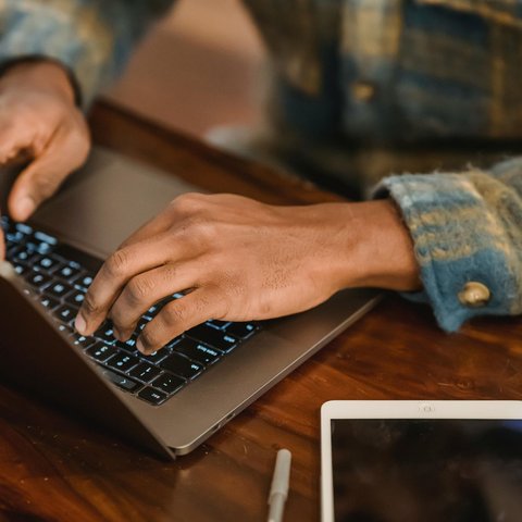 An image of a person using a laptop