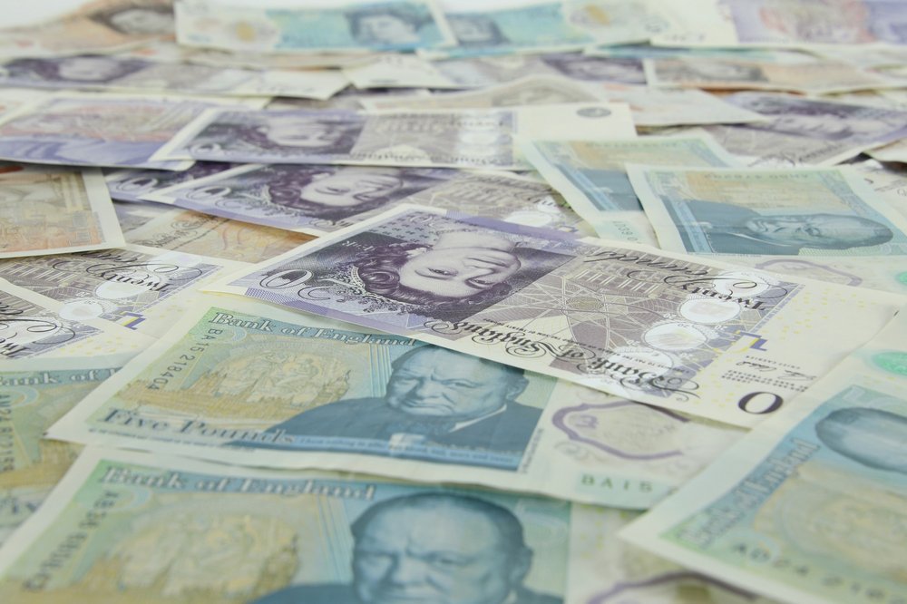 Image of layers of GBP bank notes laying on a flat surface