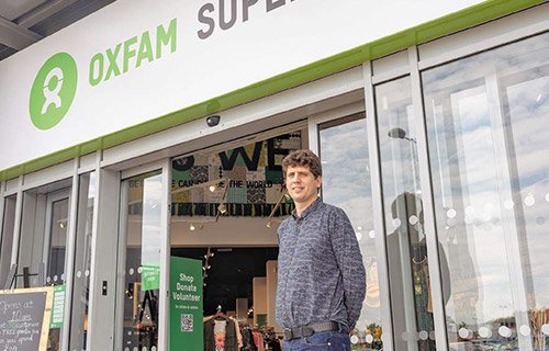 Richard stands outside the new Oxfam superstore, Manchester.