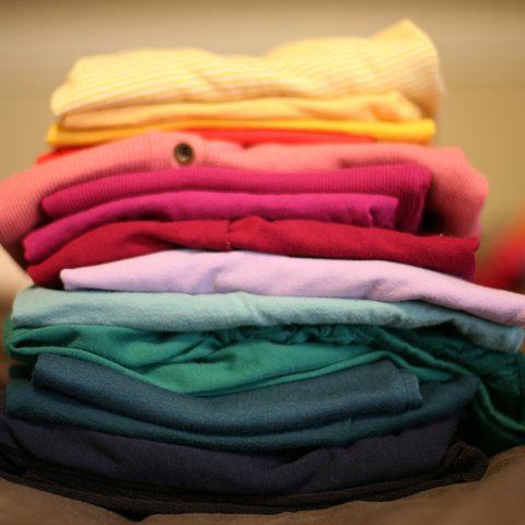 A colourful stack of folded laundry