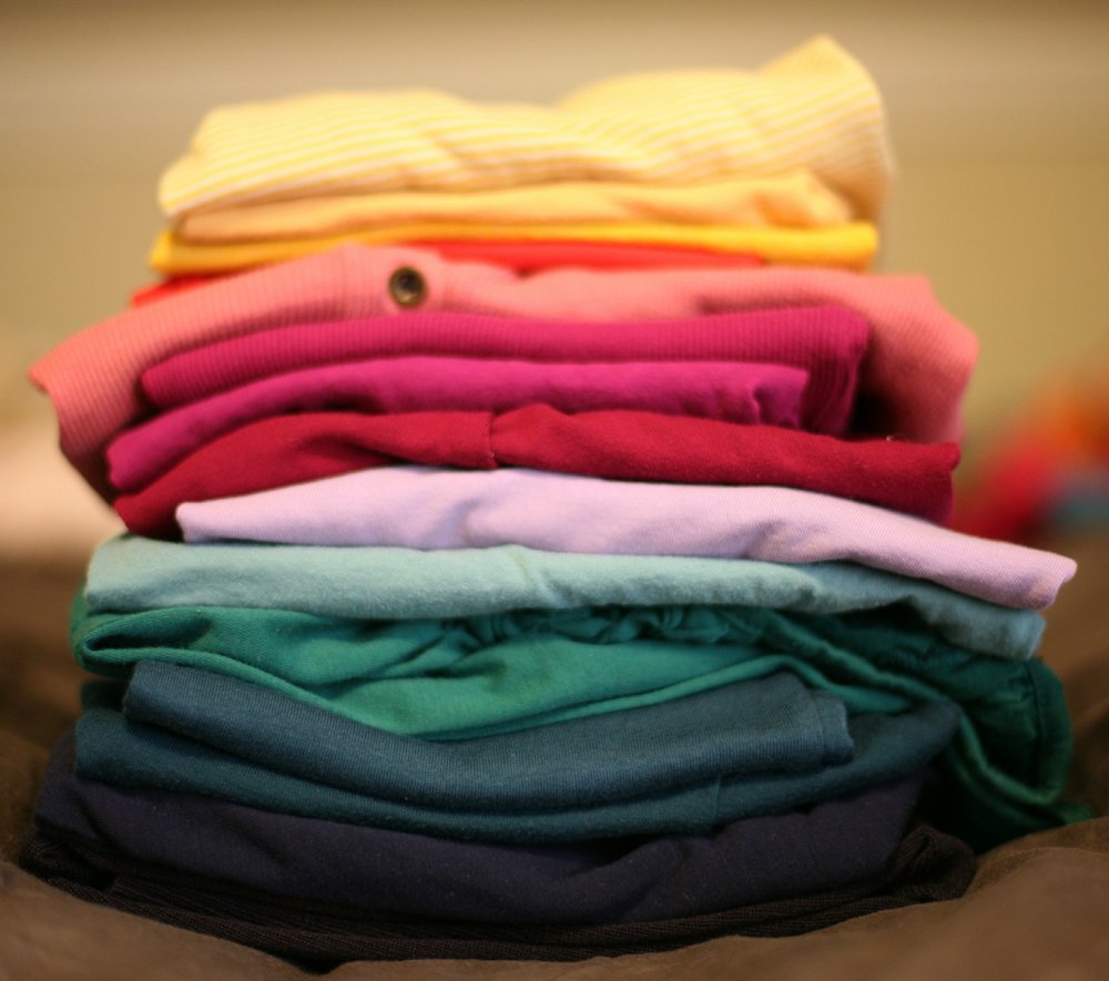 A colourful stack of folded laundry