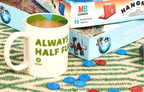 a selection of board games and a cup of tea with the message 'always half full' on