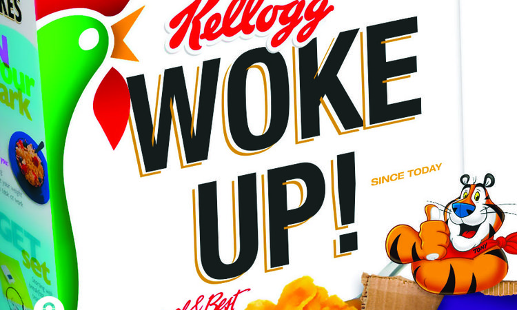 A kellogs cornflakes cereal box with 'woke up!' written on it