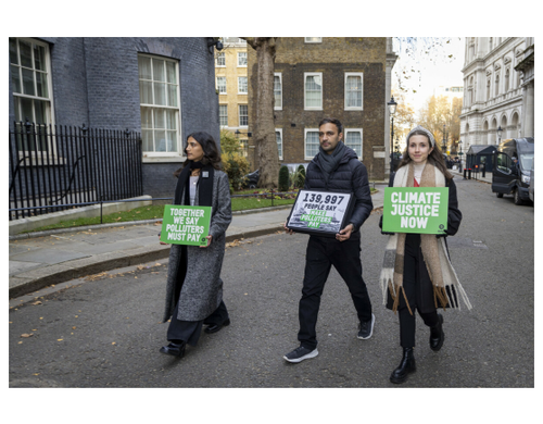 Campaigners handing in Oxfam's Make Rich Polluters Pay petition at 10 Downing Street, London.