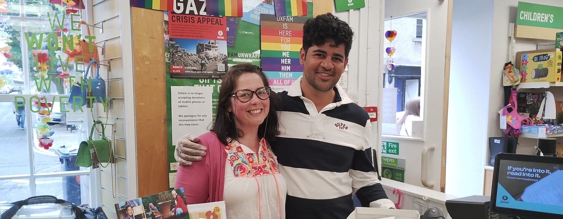 Image of Meg and Soham behind the till in Oxfam Chapel Street store