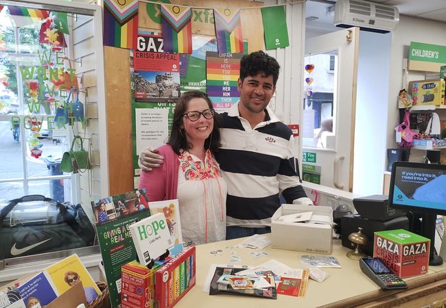 Image of Meg and Soham behind the till in Oxfam Chapel Street store