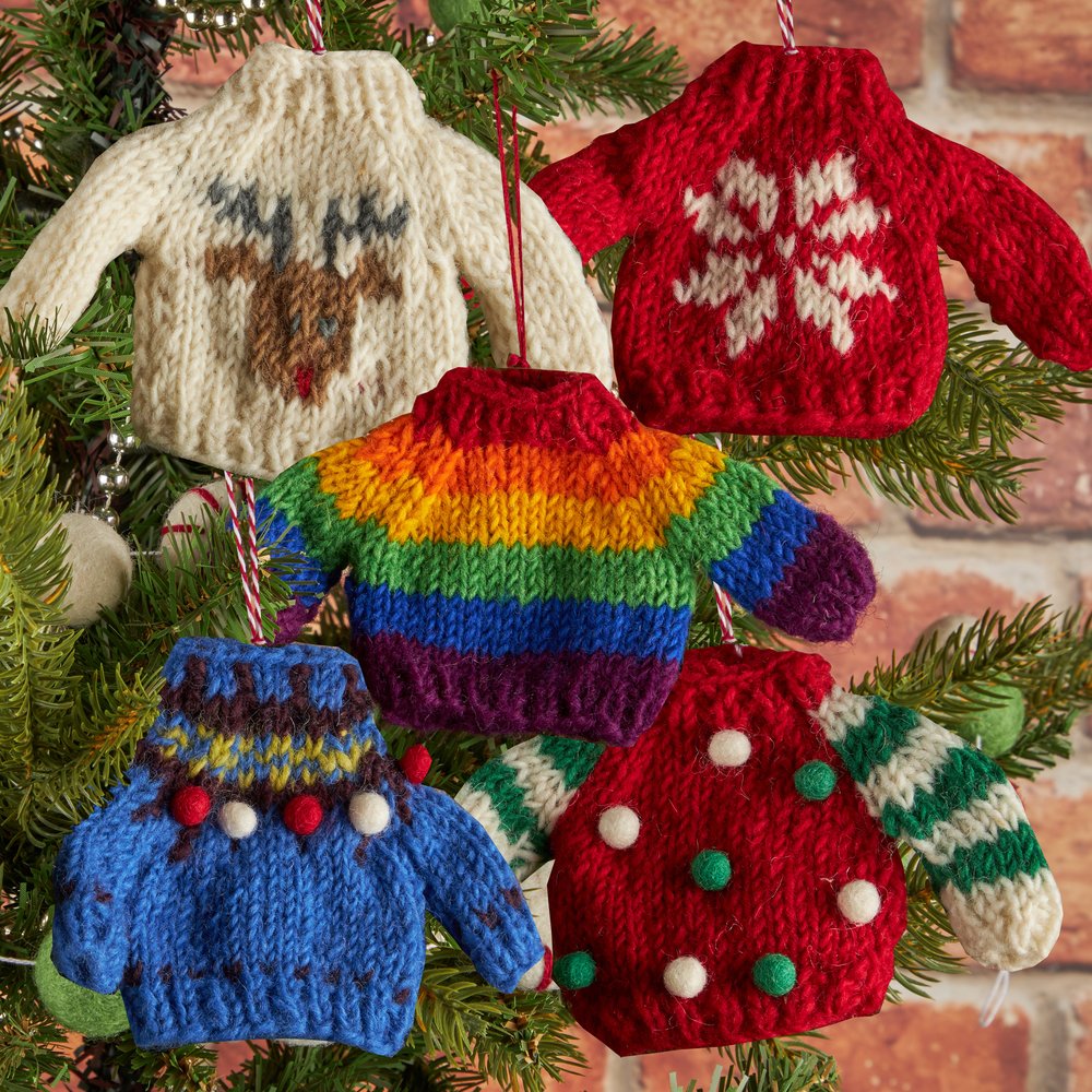 A montage of five Christmas decorations shaped like jumpers