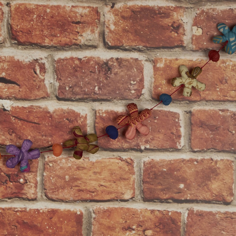 flower garland draped across a wall