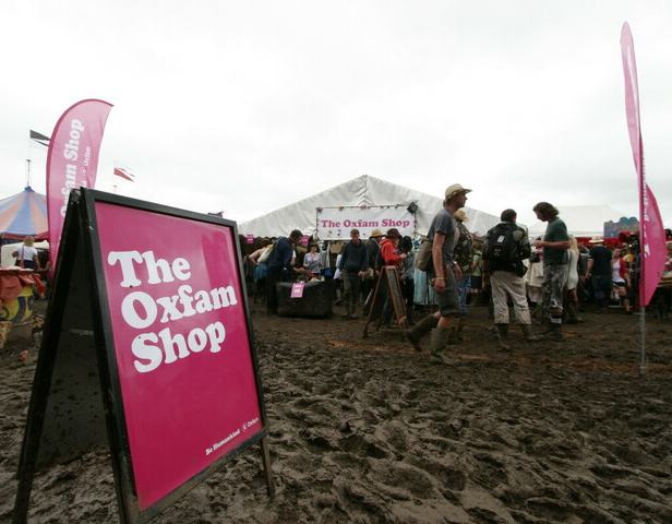 Festival goers visit the Oxfam shop during the 2011 Glastonbury festival. Photo: Oxfam