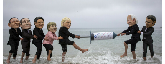 Campaigners from Oxfam and The People’s Vaccine Alliance pose as world leaders at the G7 summit in Cornwall, 2021.