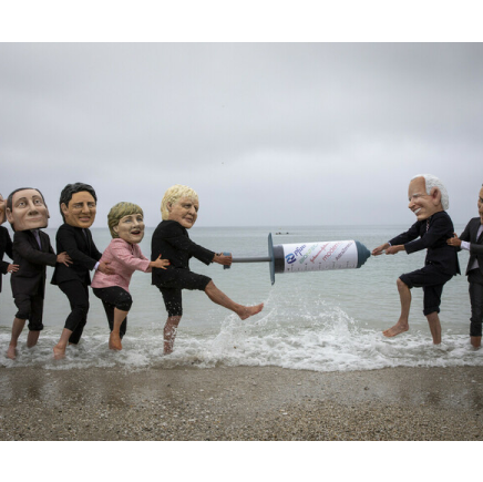 Campaigners from Oxfam and The People’s Vaccine Alliance pose as world leaders at the G7 summit in Cornwall, 2021.