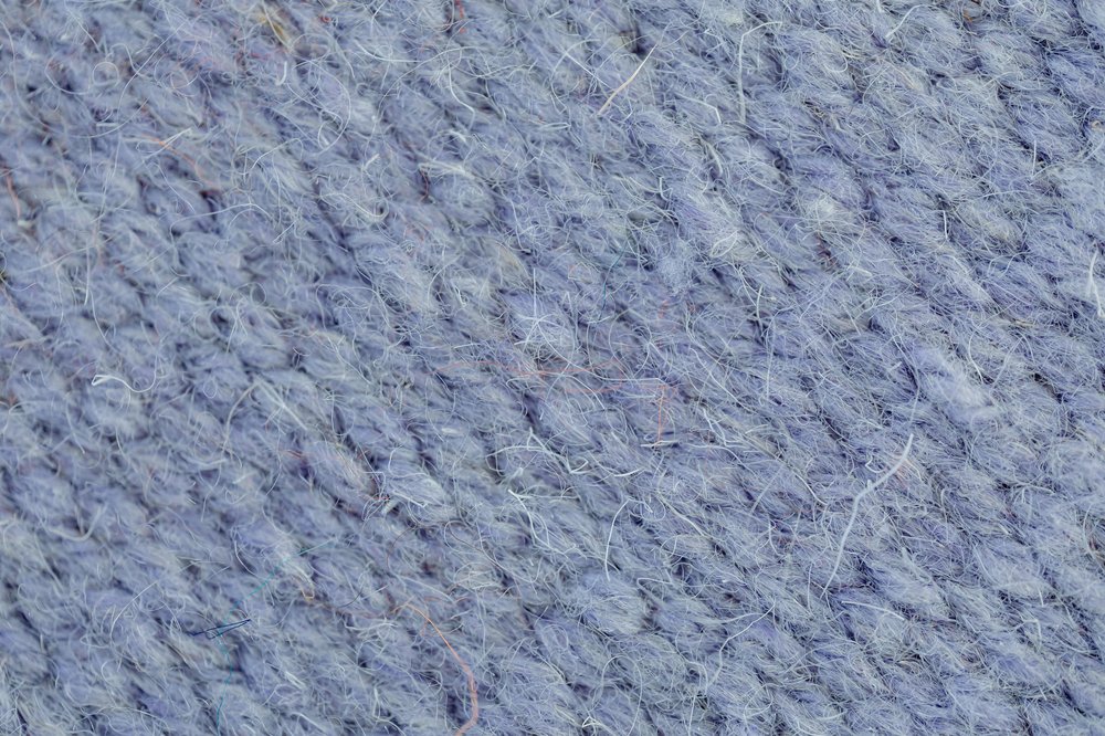 Wool texture close up of a wool piece of clothing.