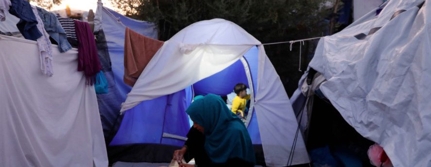 A family in a tent in Moria refugee camp in Greece