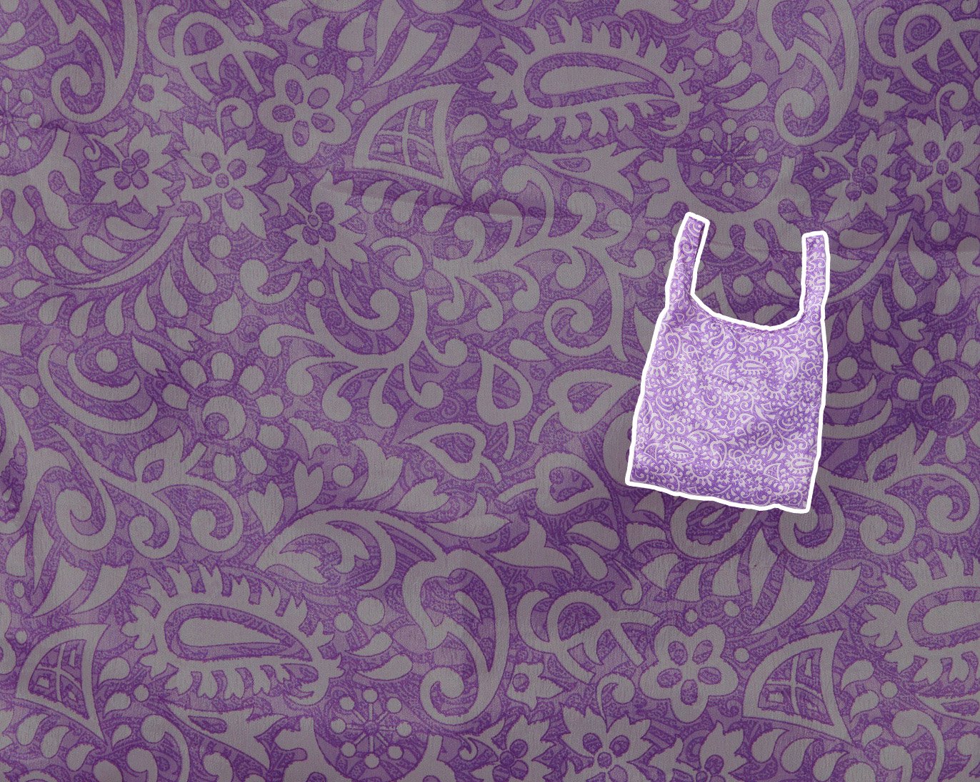 A recycled purple patterned sari tote bag on a purple patterned background