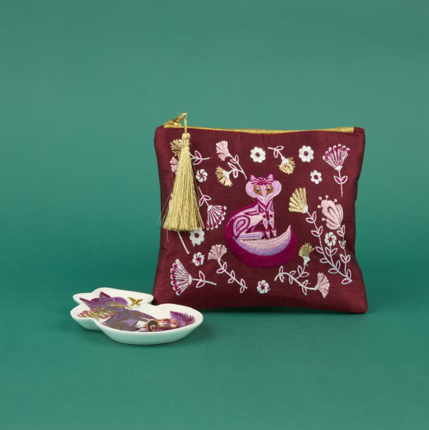 Purple pouch with an intricate Belinda Lyon design on the front