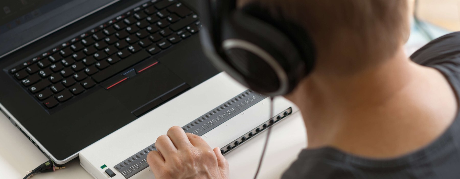 Person using braille keyboard