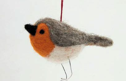 A Christmas tree decoration shaped like a robin and made from felt.