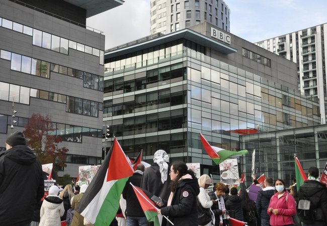 Salford, Greater Manchester, UK. 10.21.2023: Pro Palestinian protesters gather en masse outside BBC offices in Media City, Salford, in protest of broadcaster's coverage of Israel Palestine conflict.