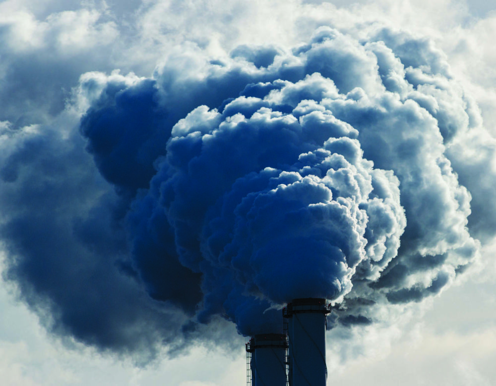 Smoke coming out of a coal plant chimney