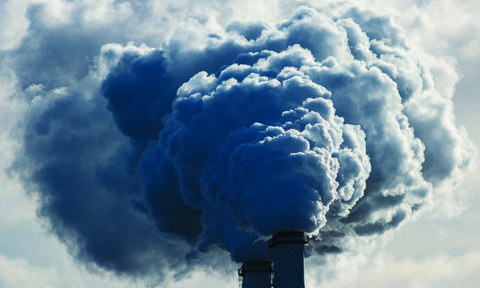 Smoke coming out of a coal plant chimney