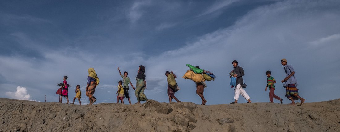 Rohingya refugees fleeing Myanmar for Bangladesh.