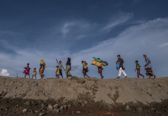Rohingya refugees fleeing Myanmar for Bangladesh.