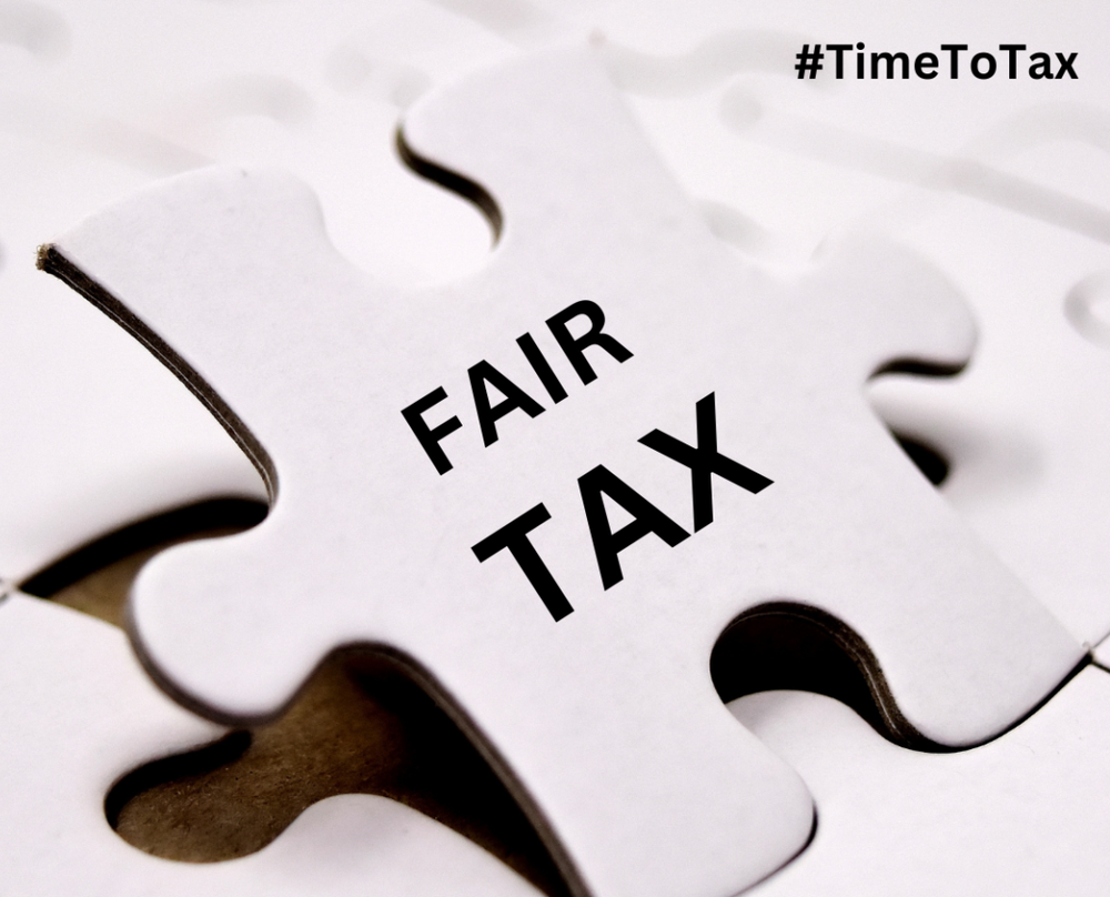 Puzzle piece standing upright reading Fair tax.