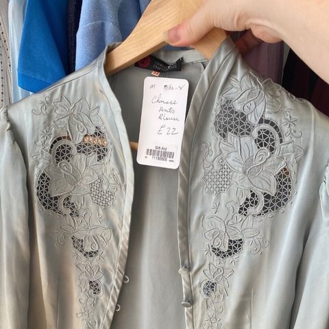 A grey silk vintage shirt with floral detail