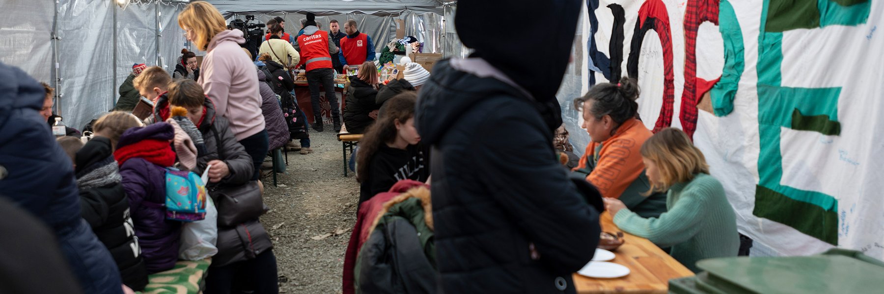 Refugees from Ukraine arriving at a staging area at the Polish border.