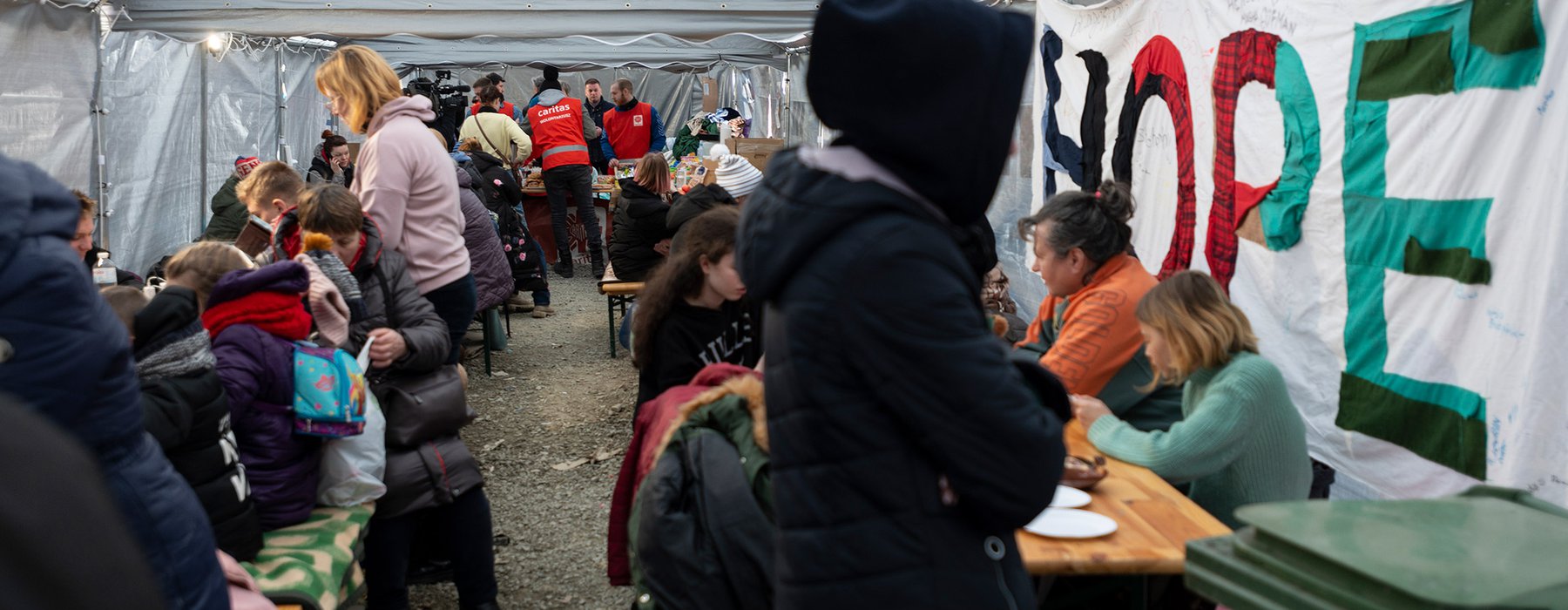 Refugees from Ukraine arriving at a staging area at the Polish border.