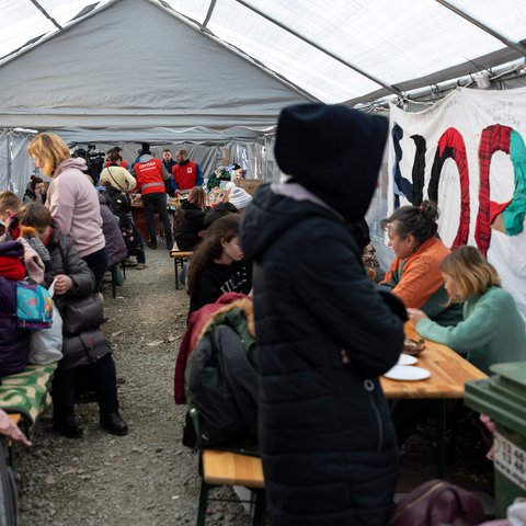 Refugees from Ukraine arriving at a staging area at the Polish border.