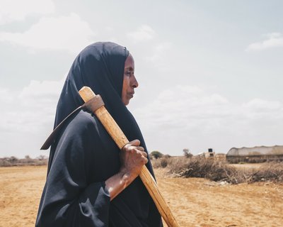 Diyaara stands in the farm that she used to provide food for her family.
