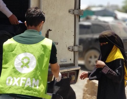An Oxfam Public Health Officer at a hygiene kit distribution in Taiz, Yemen