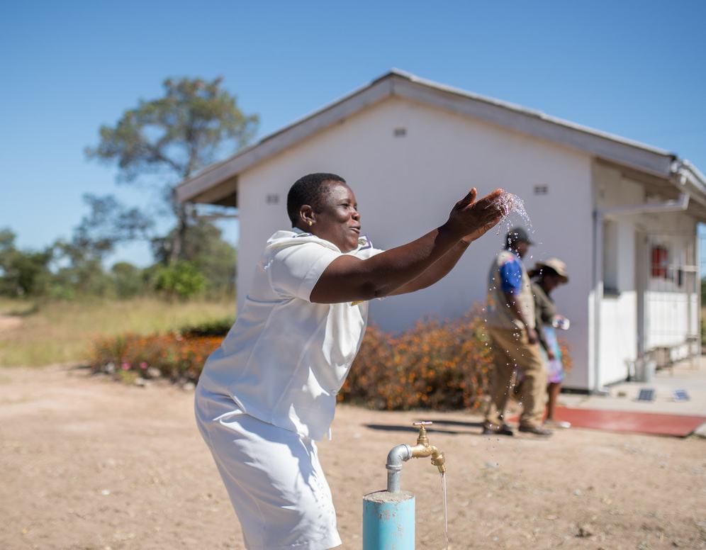 Nurse Tsitsi celebrates having running water for the first time at Somerton clinic in Masvingo District, Zimbabwe.